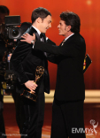 (L-R) Jim Parsons accepts the award for &quot;Outstanding Lead Actor in a Comedy Series&quot; from Charlie Sheen