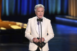 John Walsh from America&#039;s Most Wanted presents an award at the 75th Creative Arts Emmy Awards