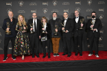 The team from Jeopardy! backstage at the 75th Creative Arts Emmy Awards