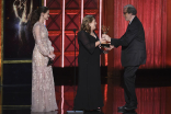 Alexis Bledel and Ann Dowd present an award to Jeff Beal at the 2017 Creative Arts Emmys. 