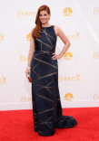 Debra Messing arrives at the 66th Emmys.