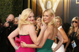 Elisabeth Moss and January Jones on the red carpet at the 67th Emmy Awards. 