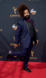 Reggie Watts on the red carpet at the 2016 Primetime Emmys. 