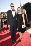 Joel McHale and Sarah Williams on the red carpet at the 2016 Primetime Emmys. 