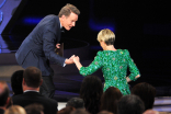 Bryan Cranston presents the award to Sarah Paulson at the 2016 Primetime Emmys. 