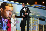 Alexander Skarsgard accepts an award at the 69th Emmy Awards.