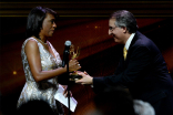 Pat Harvey accepts the Governor&#039;s Award from Paul Button at the 67th Los Angeles Area Emmy Awards July 25, 2015, at the Skirball Cultural Center in Los Angeles, California.